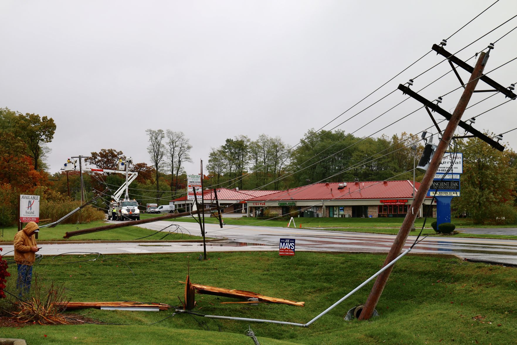 Power poles shear off in chain, knocking out power in Winfield